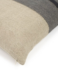 The Libeco Home Black House Stripe Pillow features a striped pattern in beige, grey, and dark charcoal with a visible zipper, shaped to fit a 25x25 insert.