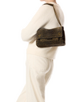 Jerome Dreyfuss Lulu M leopard print mini bag with chain strap, styled with a cream outfit.