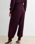 Rachel Comey Nim Pant and matching sweater in beige, styled with heels on a light carpet for a cozy look.