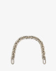 The Shortie Strap by Clare Vivier is a single chain of interconnected silver links featuring vintage brass, elegantly curved against a plain white background.