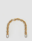The Shortie Strap Q1 by Clare Vivier features a gold and silver mix of interlocking chain links, forming a curved shape on a white background, perfect for attaching to any bag.