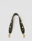 The Clare Vivier Shoulder Strap Naturelle W/ Studs is a detachable dark leather strap for a shoulder bag, featuring brass studs and gold-tone lobster clasps, shown against a plain white background.