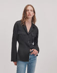 Rag & Bone Sonny silk blouse in white with blue jeans, casual women’s style against a simple white background.