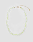 The Clare Vivier Stone Slice Necklace features transparent pale green glass beads with a gold adjustable chain and clasp, shown on a plain white background.