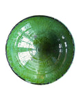 The Tamegroute Bowl by Blue Ocean Traders features a round, glossy green finish with a hand-shaped, slightly uneven rim, making it a unique decorative accent against a white background.