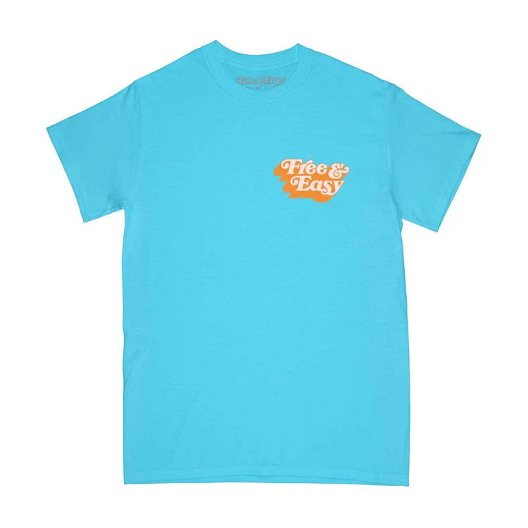The SUNDEK/KickoffUSA T-SHIRT is bright blue with an orange and white "Free & Easy" graphic on the left chest, shown on a plain white background.