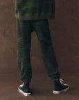 A person wearing The Stadium Sweatpant by The Great Inc., inspired by vintage athletic wear and handcrafted in Los Angeles.