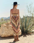 Verse Dress by The Great Inc. styled with boots and hat outdoors beside a rock and agave plant for a relaxed vibe.