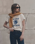 Boxy Crew Growling Panther tee by The Great Inc. with jeans and yellow sweater styled for a casual day out.