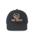 The Baseball Hat by The Great Inc. is a black cap with vintage chainstitch embroidery of a tan bear face above "THE GREAT" on the front, and features an adjustable strap for comfort.