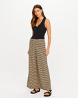 The Upside Santos Adriel Split Pant in black, styled with a sleeveless top, on model against white background.