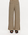 Cream and black striped Santos Adriel Split Pant by The Upside, shown from the back with black sandals.