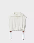 The Rag & Bone vintage terry half zip muscle is a sleeveless white cotton-blend pullover with a half-zip collar, drawstring hem, and red side cords in bows, giving it a subtle vintage vibe against a clean background.