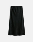 The Claire Skirt by Alex Mill is a plain black, midi-length bias-cut piece with a subtle crinkled texture and pull-on waist, shown against a white background—ideal for seamless day-to-night looks.