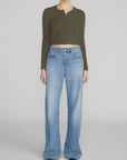 FRAME Cashmere Airy Cardi paired with wide-leg blue jeans, casual style on neutral backdrop.