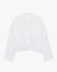 The Scrunchie Frenchie by Mother is a white cropped button-up shirt with long wide sleeves, a collared neckline, front chest pocket, and an elasticized hem, shown laid flat on a plain white background.