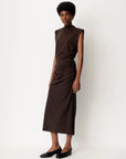 Sessun DOLISH long skirt paired with black flats, showcased against a simple white background.