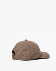 The Clare Vivier Wool CIAO Baseball Hat in brown herringbone is displayed from the back and side, showing its adjustable strap against a plain white background.