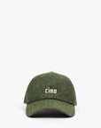 The Clare Vivier Wool CIAO Baseball Hat features a green herringbone wool design with "CIAO" embroidered in white on the front, inspired by classic Peaky Blinders style and shown against a plain white background.