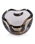 The Zodax CH-7877 Viento Glass Bowl features a clear, heart-shaped design with smooth, rounded edges and is shown against a white background.