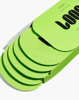 A partially opened bright green Loops/HydroGel Face Masks box from Faire shows several matching green packets fanned out, likely containing moisturizing face masks.