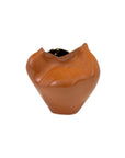 The Import Collection 20-490 Abitar Vase: a glossy, brown ceramic vase with an organic shape and small opening, perfect as sculptural decor for modern homes. Shown against a white background.