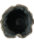Top view of the Bloomingville Wavy Blue Stone Vase, featuring an irregular, wavy rim and dark glossy interior. The uneven, organic edge echoes the natural look of this handmade round stone vase.