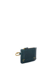 A Popoche XS Pouche from Jerome Dreyfuss, crafted in compact, dark green goatskin leather with yellow stitching and a gold zipper, is shown on a white background. It includes a gold clasp on one side to secure keys or other items.
