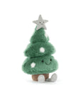The Amuseables Christmas Tree by Jelly Cat Inc. is a green plush with white spots, a smiling face, grey feet, and a grey star on top, sitting on a brown base—perfect for festive décor.