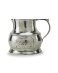 The Faire Vintage 1815 Large Pitcher features a single handle, wide base, and an "1815" engraved plaque. Its slightly uneven surface showcases Italian handcrafted charm, embodying the elegance of a classic vintage piece.
