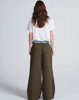 ASKK Greenwich Pant in white, shown from the back, styled with a white tee against a plain background.