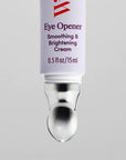 A close-up of a Faire Eye Opener - Smoothing & Brightening Cream tube (0.5 fl oz/15 ml) for dark circles and puffiness, with a metallic applicator tip, set against a plain light gray background.