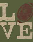 The Boston Cocktail Napkins by Faire feature the word "LOVE," with a brown football as the "O" on a green textured background and distressed cream letters—perfect for parties.