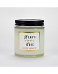 A clear glass jar with a black lid labeled "Bear's Cave" and "Austin Press SF," containing the white, all-natural Austin Press Travel Candle by Faire, made from botanical waxes, is shown against a plain white background.