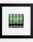A framed picture displays the cover of a matchbook from The Beverly Hills Hotel and Bungalows. The matchbook cover, encased in clear acrylic, is green with vertical white stripes, and the hotel's name is written in elegant white script. This display is presented in an Art Square Blk Frame by Match South.