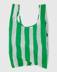 The Big Baggu by Baggu is a slouchy carry-all shopping bag with vertical green and white stripes, crafted from recycled ripstop nylon and displayed against a plain white background.