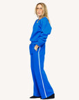 Bright blue fleece Weekend Palazzo pants by Kerri Rosenthal, shown from the side against a white background.