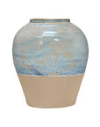 The Import Collection 38-434 Moroson Vase is a ceramic table vase with a round body and narrow opening, featuring a glossy blue and beige top blending into a matte beige base for a simple modern look.