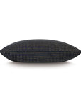 The OCTAVIUS WOOL rectangular pillow by Eastern Accents features a charcoal hue with small, evenly spaced gold dots. Shown side view on white background, this stylish 15x26 decorative pillow enhances any space.