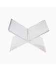 The Faire Acrylic Book Stand Display features two intersecting clear panels forming an X shape, ideal as a modern centerpiece for showcasing your favorite book against any white background.