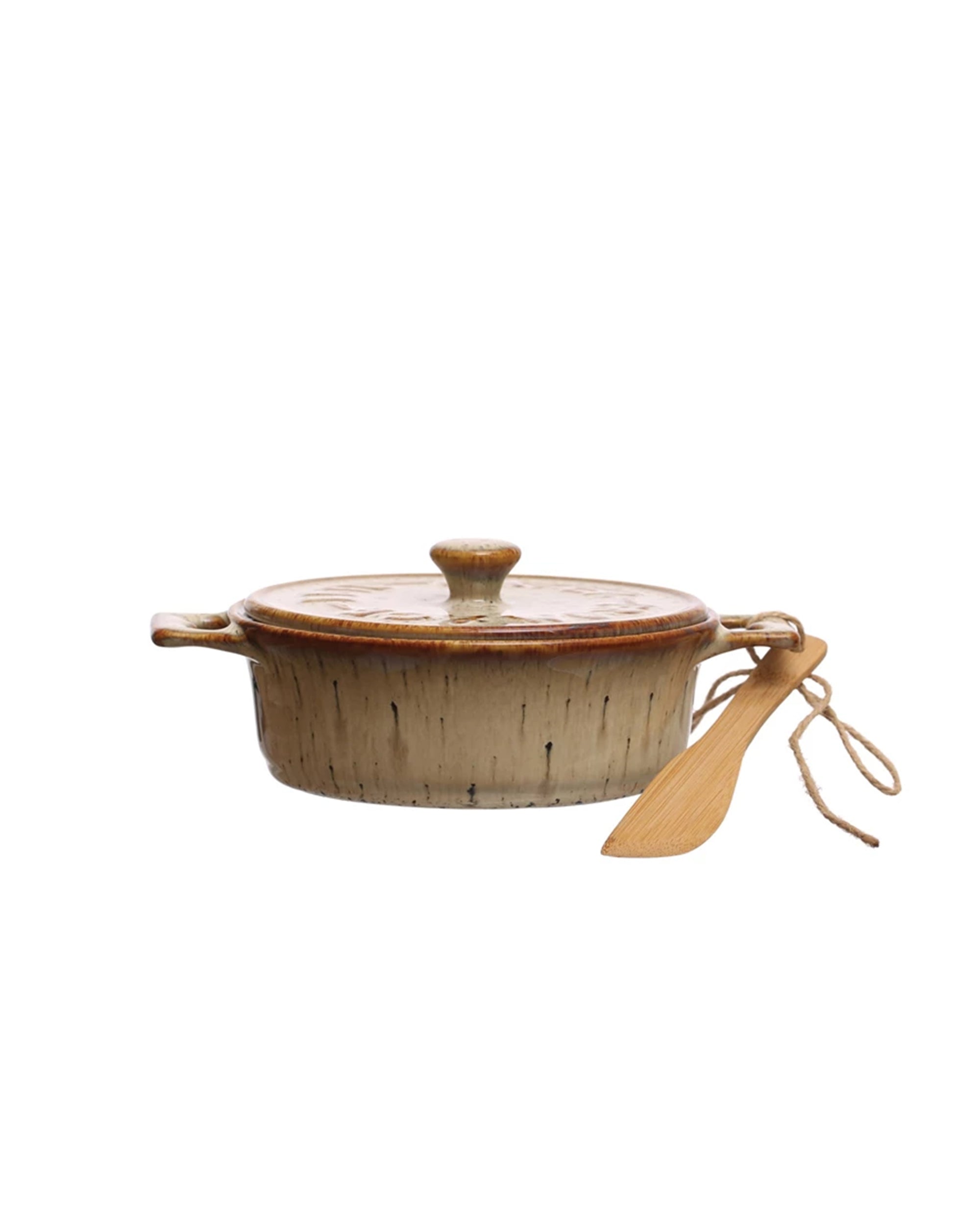 The Creative Co-op DF7975 Brie Baker with a lid and two handles features a beige and brown glazed, textured ceramic finish. A small bamboo spreader is tied to one handle, perfect for serving.