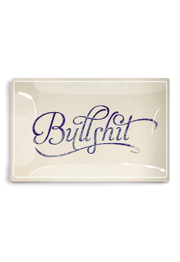 A Ben's Garden 5.5" x 8.5" tray with the word "Bullshit" written in cursive on a white background, housed in a grey frame, perfect for adorning any bungalow.