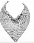 The Faire Chain Mail Bandana Scarf Necklace showcases a vintage silver mesh in a triangular, chainmail-style design with a shiny finish, making a bold statement. It is displayed on a white background.