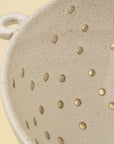 Riverstone Berry Bowl L with handle and drainage holes by Faire, artisanal stoneware for kitchen or dining use.