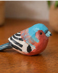 Hand-painted blue carved wood bird by The Faire, adding vivid rustic charm to any tabletop or shelf décor.