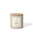 A beige 14oz. soy wax candle from Faire with a wooden lid and white label reading "Cactus Flower" sits on a white background, casting a soft shadow to the right. It offers a delightful floral fragrance.