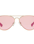 The Caddis Mabuhay Polished Gold aviator sunglasses feature thin gold frames, light pink tinted lenses, and comfortable rubber temple tips, displayed against a plain white background.