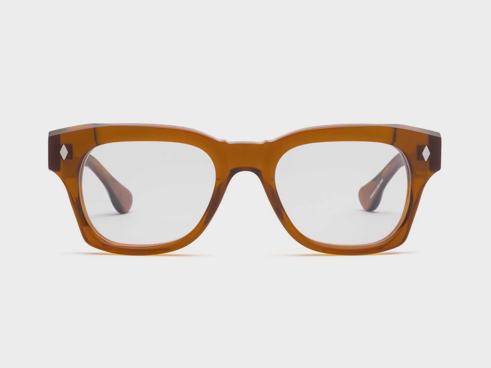 A pair of stylish, brown tortoiseshell Muzzy Progressives Gopher eyeglasses by Caddis with premium hard coating on the clear lenses, isolated on a white background.