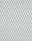 The Cala Fitted Sheet by John Robshaw features small green and blue floral shapes in a geometric, tiled pattern on white, inspired by blockprint bouquets—ideal for organic cotton percale bedding.