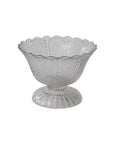 The Accent Decor 35746 Camilla Compote is a clear glass pedestal bowl with a scalloped rim, textured sides, 7x7x5.25" dimensions, and a 5.5" opening—perfect for stylish serving or elegant display.